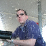 Dan cleans bugs off of the windshield