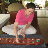 Katie plays her round during a game of congkak -- a traditional Malaysian game.
