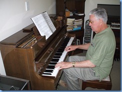 Club Treasurer, Jim Nicholson, enjoying Phyl Briscoe's lovely Schimmel piano