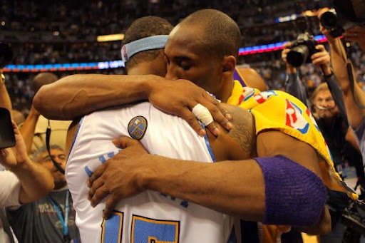 DENVER - MAY 29: Kobe Bryant #24 of the Los Angeles Lakers hugs Carmelo Anthony #15 of the Denver Nuggets after the Lakers defeated the Nuggets 119-92 in Game Six of the Western Conference Finals during the 2009 NBA Playoffs at Pepsi Center on May 29, 2009 in Denver, Colorado. NOTE TO USER: User expressly acknowledges and agrees that, by downloading and or using this photograph, User is consenting to the terms and conditions of the Getty Images License Agreement. (Photo by Doug Pensinger/Getty Images)