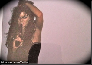 Lindsay Lohan Poses With Gun For Photoshoot