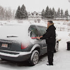 That's not pretty! Me clearing the car of light snowfall.