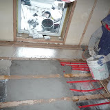 Green Show House k - jan 19 2009 concrete thermal mass, sanded floor, roof wall, salvaged door