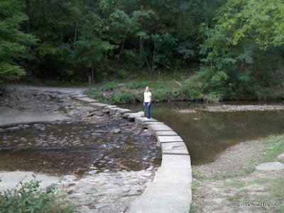Cynthia crossing the creek.