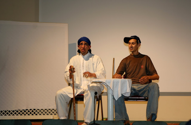 Students perform a play for the conference attendees