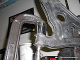 Using a C Clamp to remove the bushing