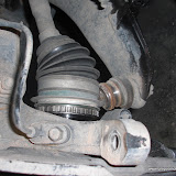Ball joint popped allows the knuckle to lean out and therefore removal of the half shaft.