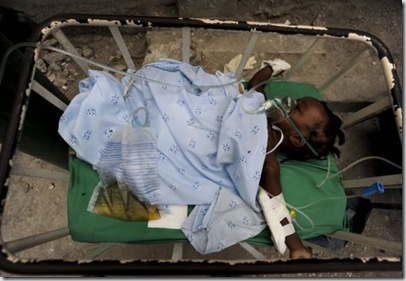 A child treated at the #Haiti Doctors Without Borders run Carrefour hospital recovers in a quiet area after she is stabilized. © Julie Remy