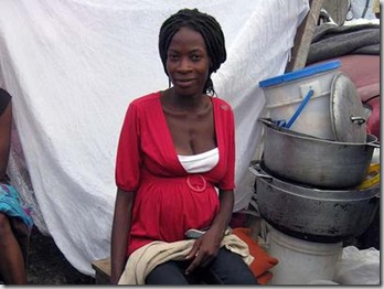 A heavily pregnant Natacha Locita, whose baby is due next month, sells produce at a squatters' camp in Port-au-Prince on Sunday.