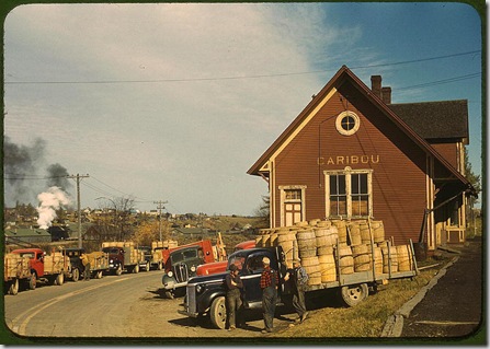 Trucks outside of a starch factory. Caribou, Aroostook County, Maine, October 1940. Reproduction from color slide. Photo by Jack Delano. Prints and Photographs Division, Library of Congress