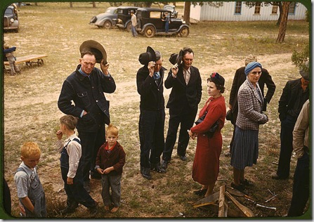 Saying grace before the barbeque dinner at the New Mexico Fair. Pie Town, New Mexico, October 1940. Reproduction from color slide. Photo by Russell Lee. Prints and Photographs Division, Library of Congress