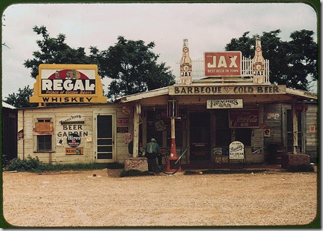 A crossroads store, bar, "juke joint," and gas station in the cotton plantation area. Melrose, Louisiana, June 1940. Reproduction from color slide. Photo by Marion Post Wolcott. Prints and Photographs Division, Library of Congress