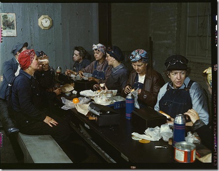 Women workers employed as wipers in the roundhouse having lunch in their rest room, Chicago and Northwest Railway Company. Clinton, Iowa, April 1943. Reproduction from color slide. Photo by Jack Delano. Prints and Photographs Division, Library of Congress