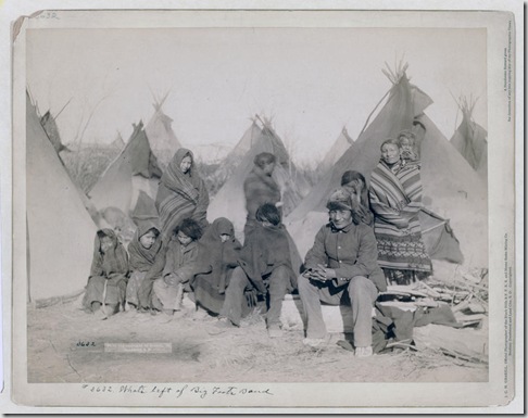 Title: What's left of Big Foot's band
Group of eleven Miniconjou (children and adults) in a tipi camp, probably on or near Pine Ridge Reservation. 1891.
Repository: Library of Congress Prints and Photographs Division Washington, D.C. 20540 USA