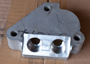 Blanking section for remote oil filter