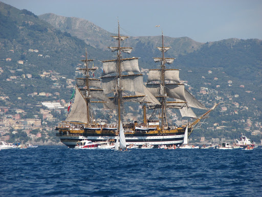 the Amerigo Vespucci, symbol of Genoas past, sails by the Genovese coast