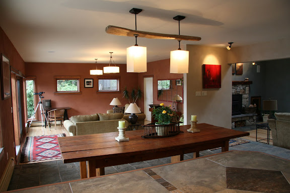 Open dining area, table and light fixture.