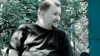 Дмитрий отвернулся и улыбнулся, как бы символизируя нам...