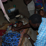  &ndash; Pa Foday prays with her. .....Dec. 2, 2007…. © 2007 NHA Photos