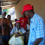  &ndash; Pa Foday presents some supplies and a watch from Nazareth House Apostolate to the chief of the Village. .....Dec. 2, 2007…. © 2007 NHA Photos