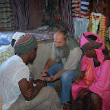  &ndash; The Big Market in Freetown, cloth merchants. Father Seraphim is discussing prayer with several of those of the Muslim faith…. © 2007 NHA Photos