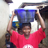  &ndash; Flood Damage: Kroo Bay cleans up after flood. …. © 2008 September NHA Media Photos, Salu Bangura, photographer. As is the usual case in face of disaster, Sierra Leoneans can still find a reason to smile.