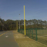 A park is built atop a close landfill in Chatham County. A series of horizontal vent pipes in gravel packed trenches was installed in the waste and covered before building ball fields on top. Collected gas is vented through the yellow pipes - which double as foul poles for the baseball fields.