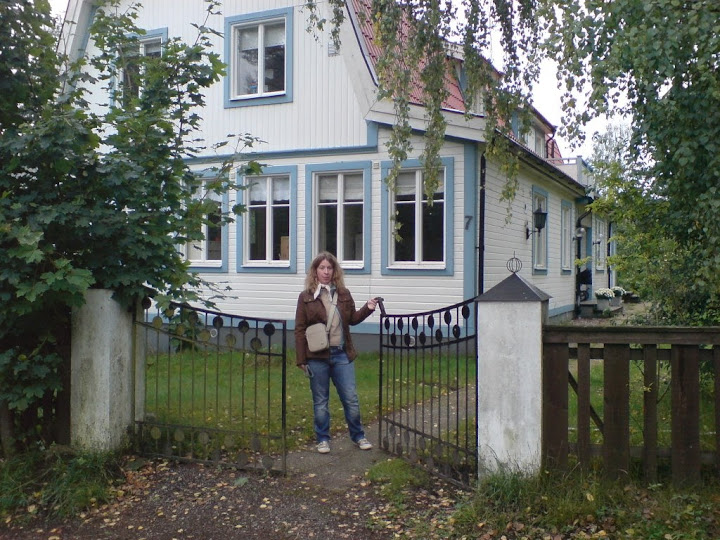 Malin in front of our new home