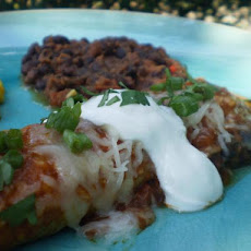Tomato Sauced Enchiladas With Sour Cream and Aged Cheese