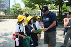 school children asking Eric to write them a message