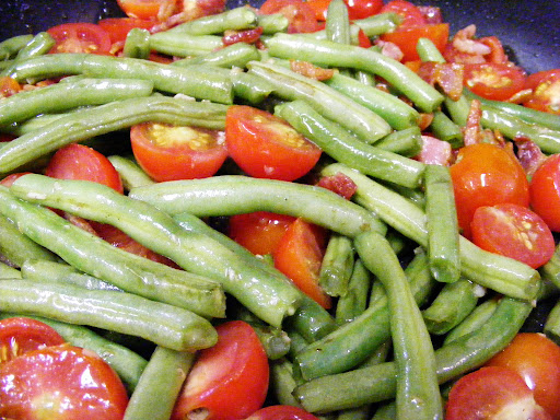 Add the tomatoes and bacon back in and heat.
