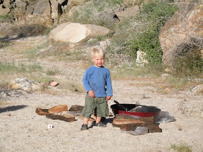Joey looking for matches to start the campfire.