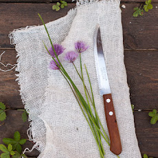 Potato salad with chives flowers and soft boiled eggs