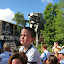 Eli on Mom's back watching the demonstration