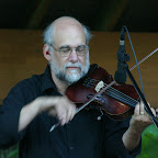Peter Knupfer shuffles up a lead fiddle part at Reed City Concerts in the Park, Summer 2007.