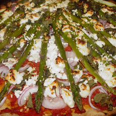 Whole Wheat Pizza with Sundried Tomato Puree, Red Onions, Asparagus, and Goat Cheese