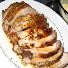 Rosemary-Scented Pork Loin Stuffed With Roasted Garlic, Dried Apricots and Cranberries and Port Wine Pan Sauce