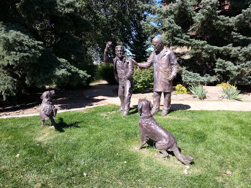 Statue Dogs Playing Fetch