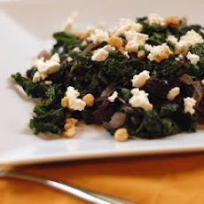 Sauteed greens w/caramelized onions, prunes & goat cheese