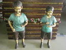 Money Children Statues 