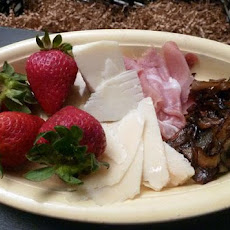 Antipasto of Prosciutto, Cheese, Strawberries and Balsamic Onion