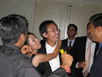 Bride and groom being dragged to the bar.