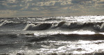Keith Wikle Surf Kayaking Lake Michigan. I'm actually in this picture, look at the third foamy formation, there is a kayak sticking out of it. keithwikle.com