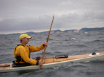 Doug Van Doren digging in to catch a ride in wind born chop on Lake Michigan, Saugatuck. keithwikle.com