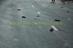 wet road, slippers left behind...