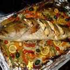 Whole Fish Roasted with a Medley of Vegetables.
