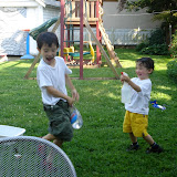 Eidan sprays Kai with water on the first hot day of Spring