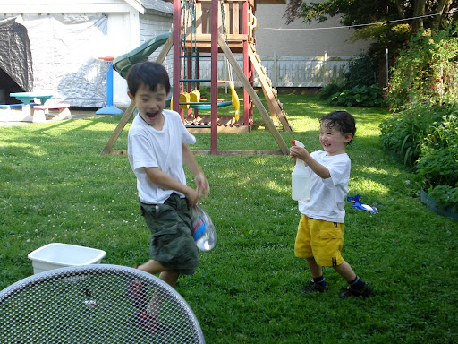 Eidan sprays Kai with water on the first hot day of Spring
