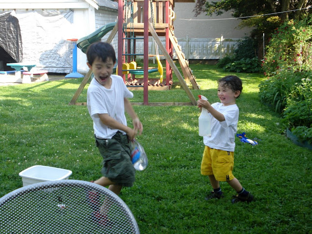 Eidan sprays Kai with water on the first hot day of Spring