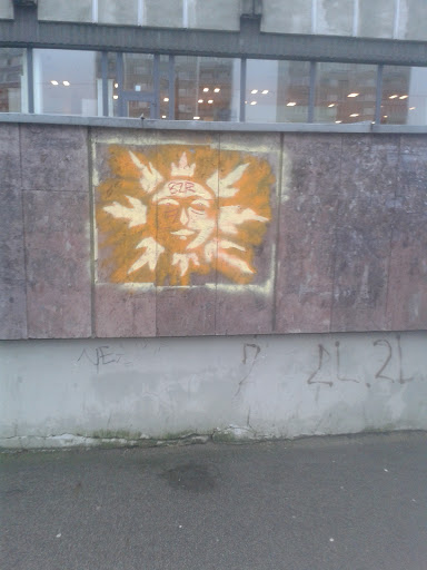 Saule uz sienas